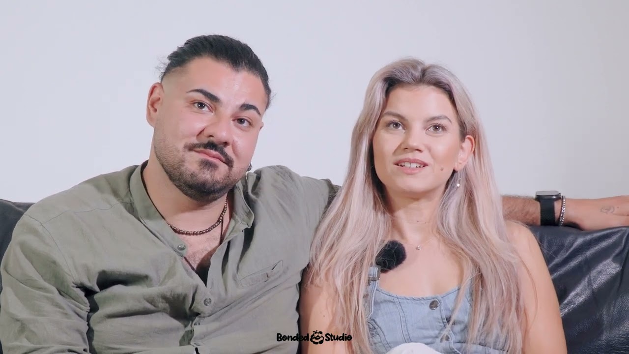 Nikky and Simona sitting together on a sofa, talking about Bonded
